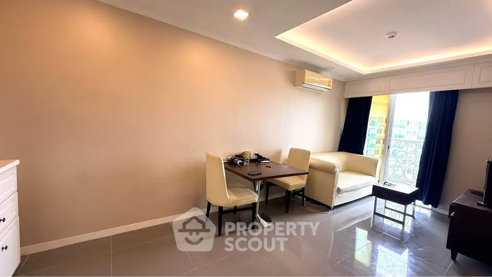 Modern living room with elegant furniture and natural light, featuring a cozy dining area and stylish decor.