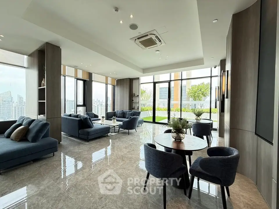 Luxurious modern living room with panoramic city views and elegant furnishings.