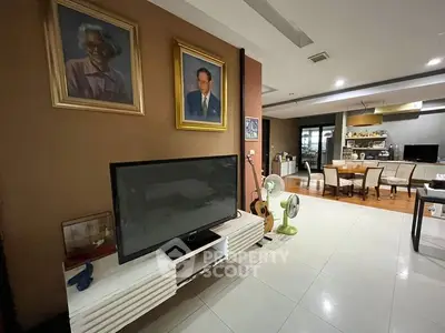Spacious living room with modern decor and entertainment setup