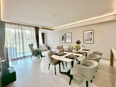 Spacious modern living room with elegant dining area and large windows