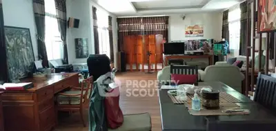 Spacious living room with elegant wooden furniture and natural light