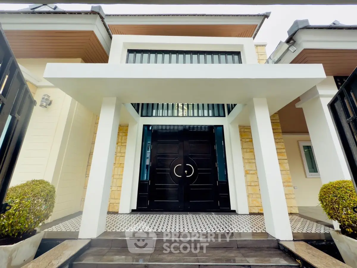 Stunning modern entrance with elegant double doors and stylish architecture