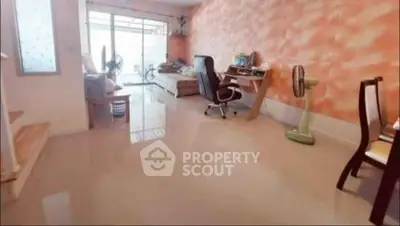 Spacious living room with modern decor and natural light