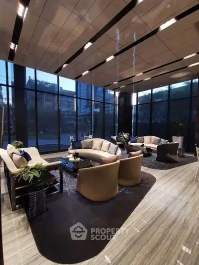 Luxurious modern living room with elegant furniture and floor-to-ceiling windows offering stunning city views.