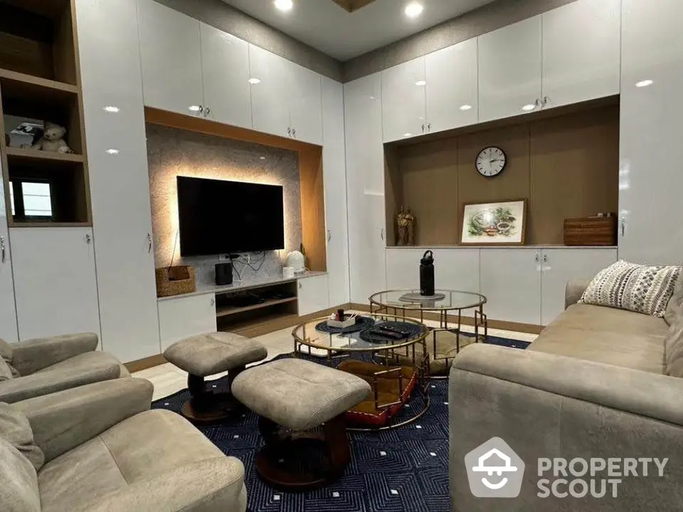 Luxurious living room with modern furniture and built-in storage cabinets