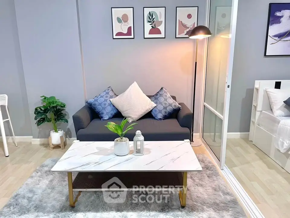 Modern living room with stylish decor and cozy seating area, perfect for relaxation and entertaining.