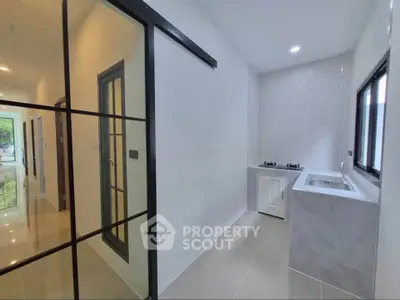 Modern kitchen with sleek design and gas stove in a bright, airy apartment