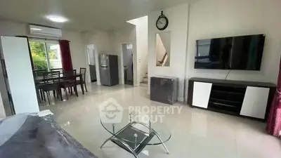 Spacious modern living room with dining area and sleek furnishings