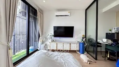 Modern bedroom with balcony access and stylish decor