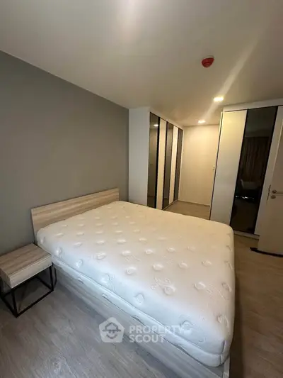 Modern bedroom with sleek design and ample storage space