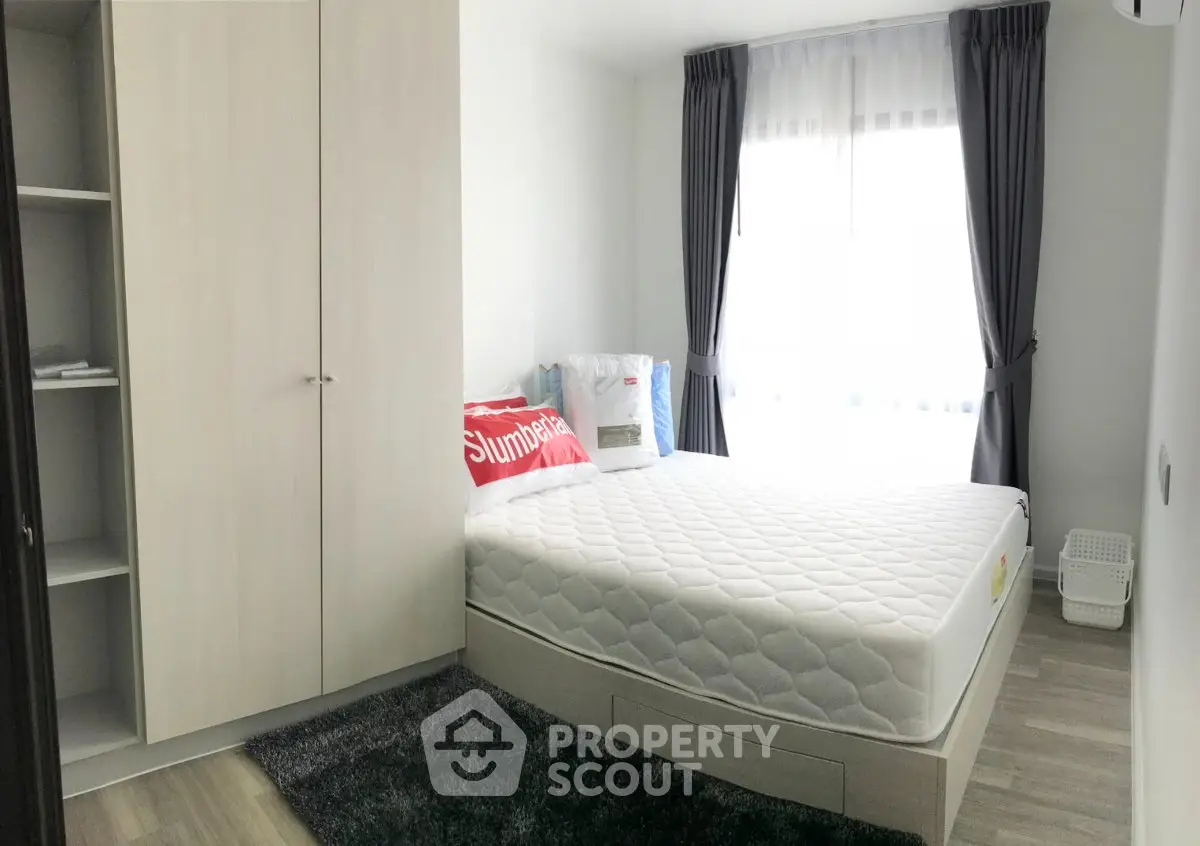 Cozy bedroom with modern furnishings and natural light