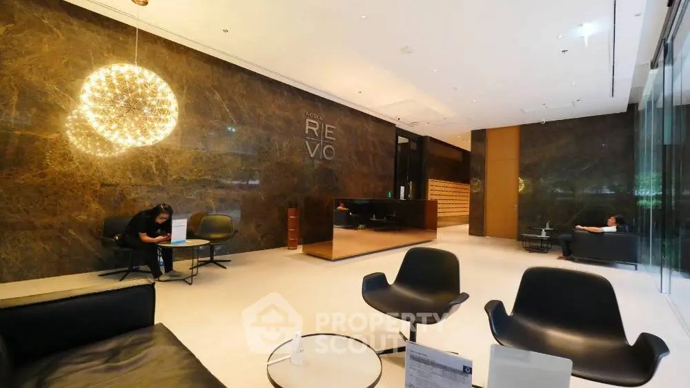 Luxurious modern lobby with elegant seating and ambient lighting in a high-end building.