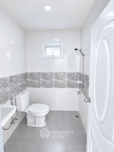 Modern bathroom with stylish tile design and sleek fixtures