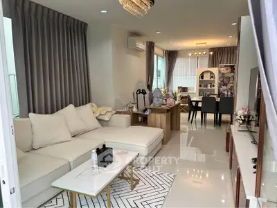 Spacious modern living room with elegant decor and open dining area