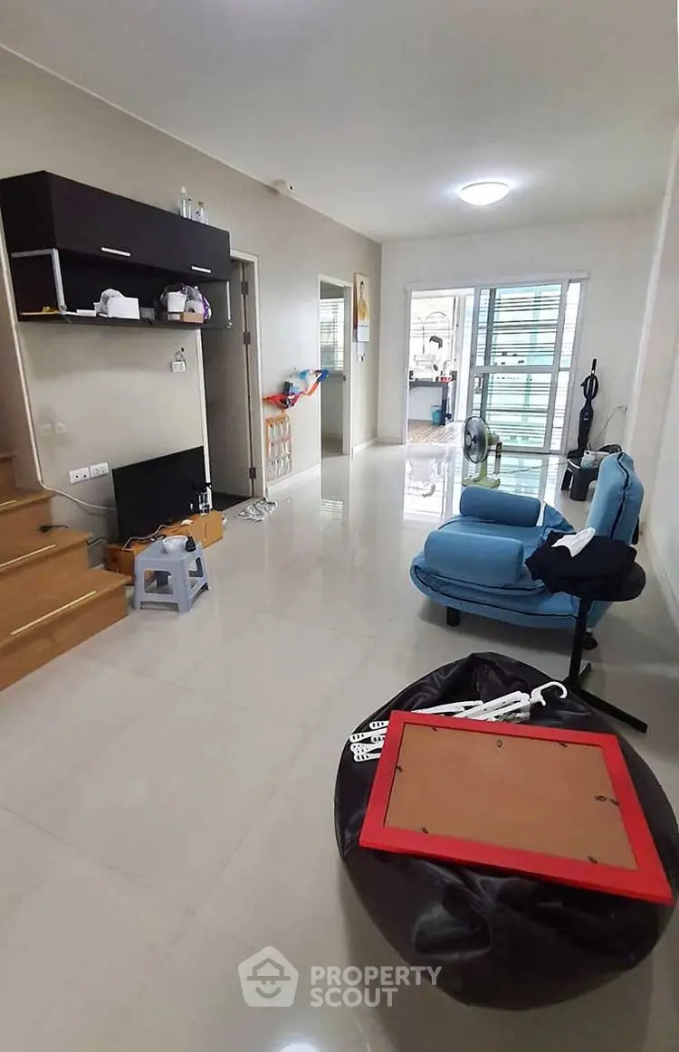 Spacious living room with modern decor and open layout, perfect for relaxation and entertainment.