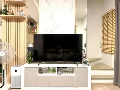 Modern living room with stylish TV setup and elegant decor