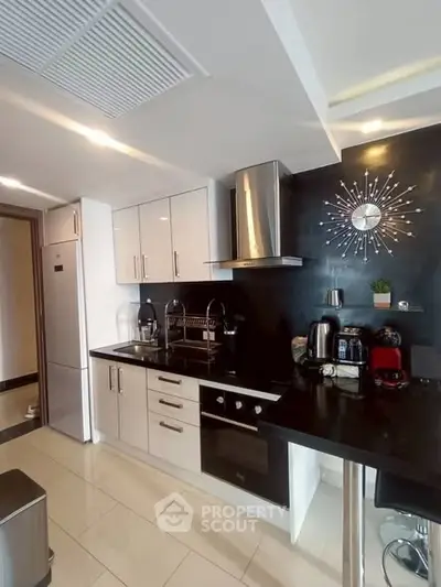 Modern kitchen with sleek cabinetry and stainless steel appliances