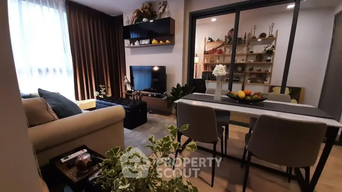 Stylish modern living room with dining area, cozy seating, and elegant decor.