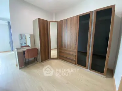 Spacious bedroom with modern wardrobe and vanity set