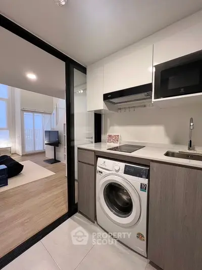 Modern kitchen with washing machine and open layout design