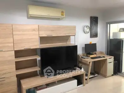 Modern living room with sleek wooden furniture and home office setup