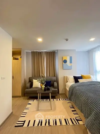 Modern studio apartment with cozy living area and stylish decor