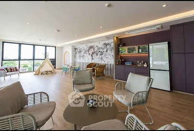Spacious modern living room with large windows and stylish decor