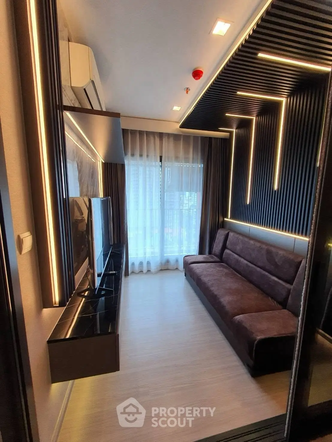 Modern living room with sleek design and ambient lighting