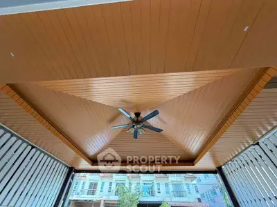 Stylish wooden ceiling with fan in modern outdoor space