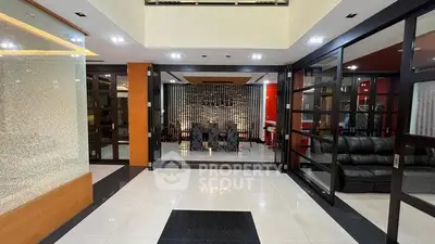 Luxurious modern living room with elegant decor and spacious seating area.