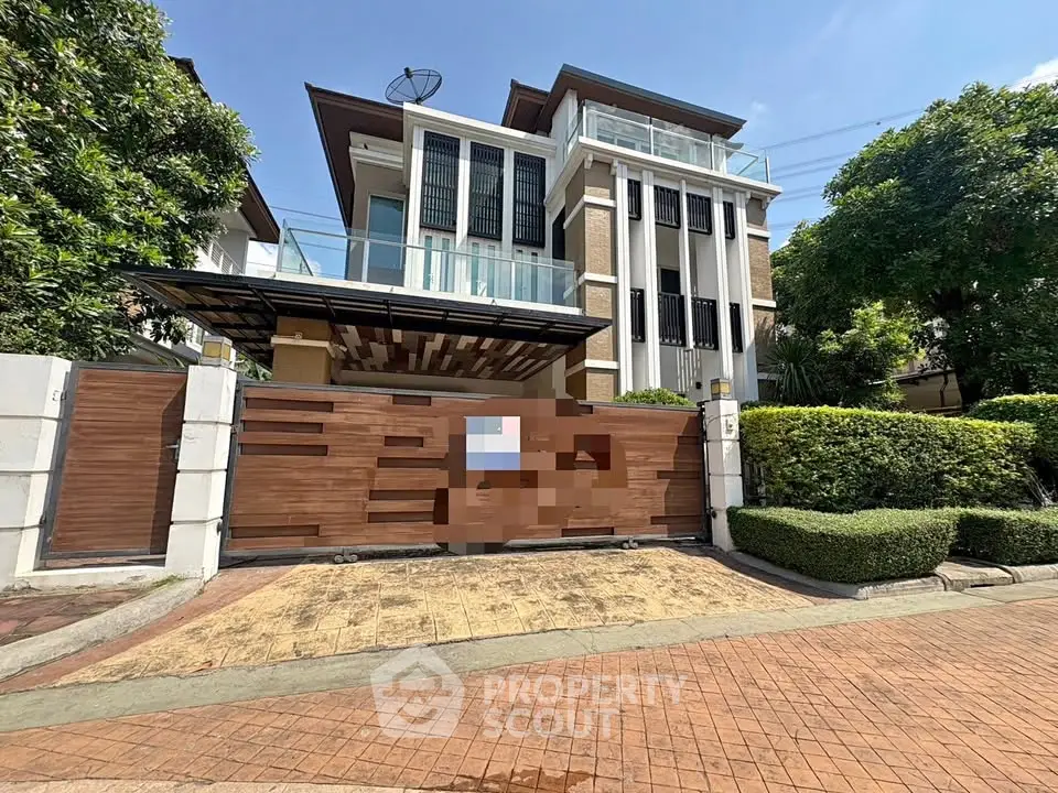 Luxurious modern house with sleek design and lush greenery in a prestigious neighborhood.