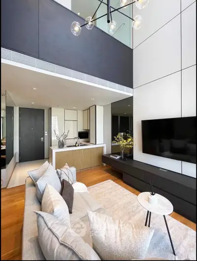 Modern living room with high ceiling and stylish decor in luxury apartment