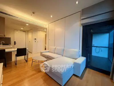 Modern living room with cozy white sectional sofa and sleek wooden flooring
