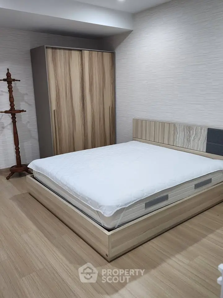 Modern bedroom with stylish wooden furniture and minimalist design