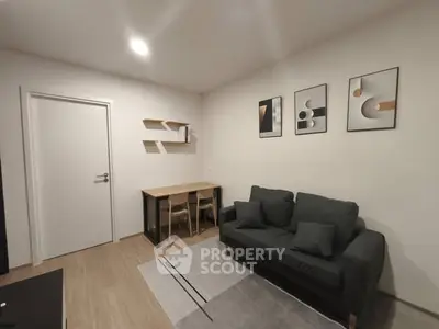 Modern living room with stylish decor and cozy seating area.