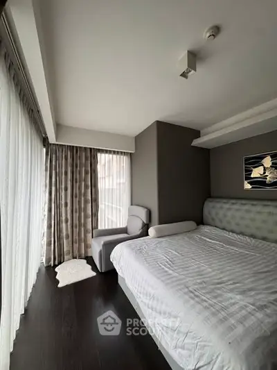 Modern bedroom with large windows and elegant decor