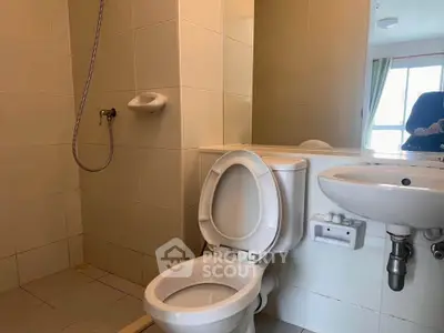Modern bathroom with shower and toilet in a bright apartment