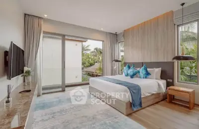 Luxurious bedroom with modern decor and large windows offering a serene garden view.