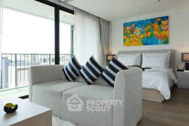 Modern bedroom with balcony access and stylish decor