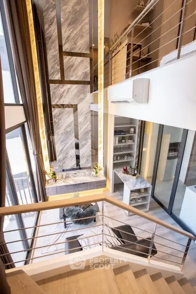 Luxurious modern living room with high ceilings and elegant staircase