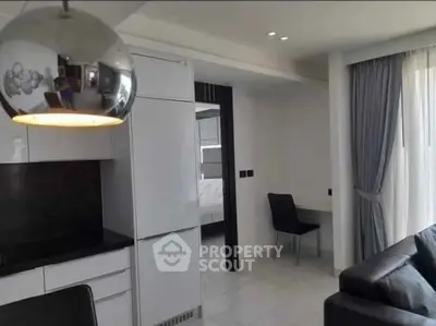 Modern apartment interior with sleek kitchen and cozy living area