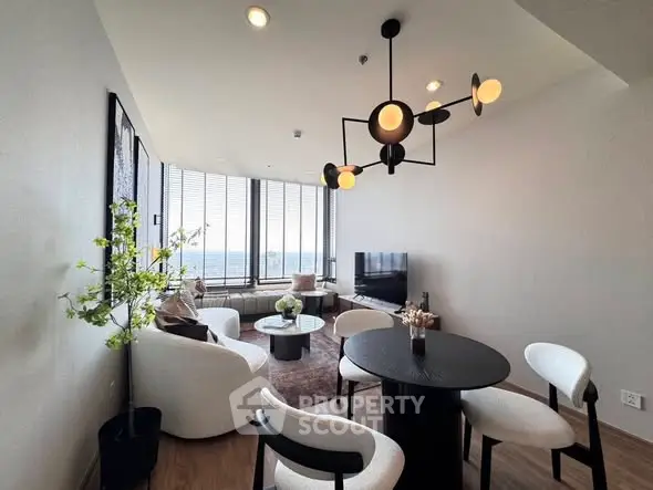 Modern living room with stylish decor and panoramic window views