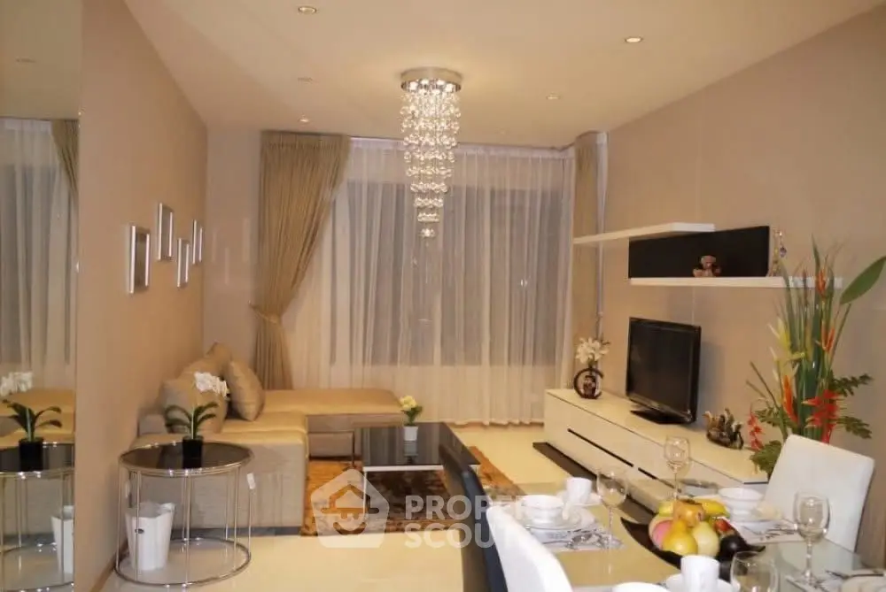 Elegant modern living room with chandelier and stylish decor