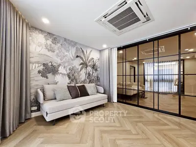 Elegant living room with stylish decor and large glass partition