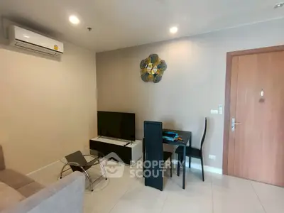Modern living room with air conditioning and stylish decor in a cozy apartment.