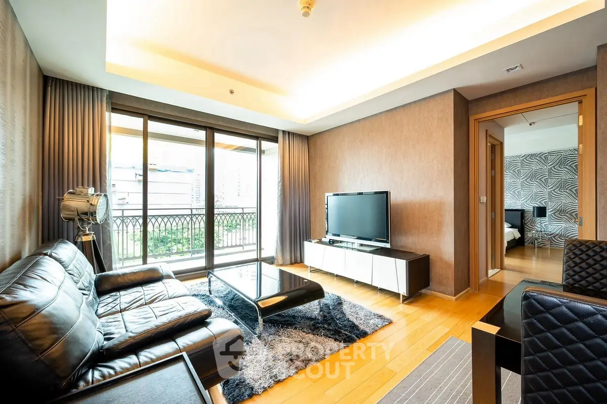 Luxurious modern living room with leather sofa and large window view