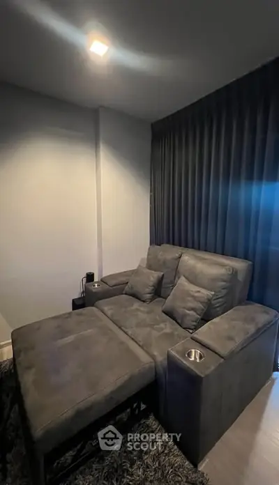 Luxurious home theater room with plush seating and ambient lighting