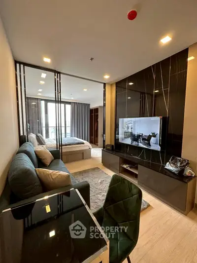 Modern open-plan living room with stylish decor and natural light