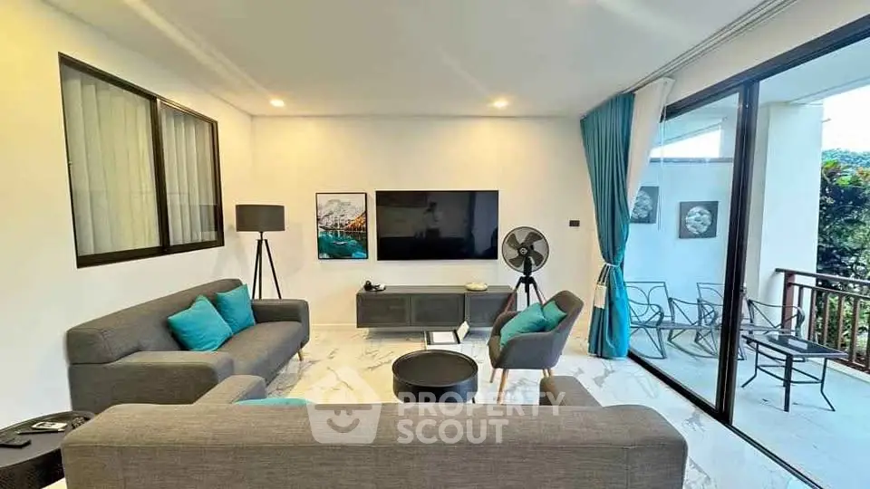 Modern living room with stylish decor and balcony view