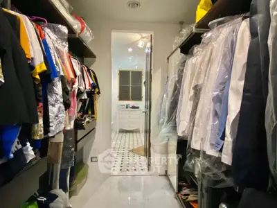 Spacious walk-in closet with ample storage and elegant design